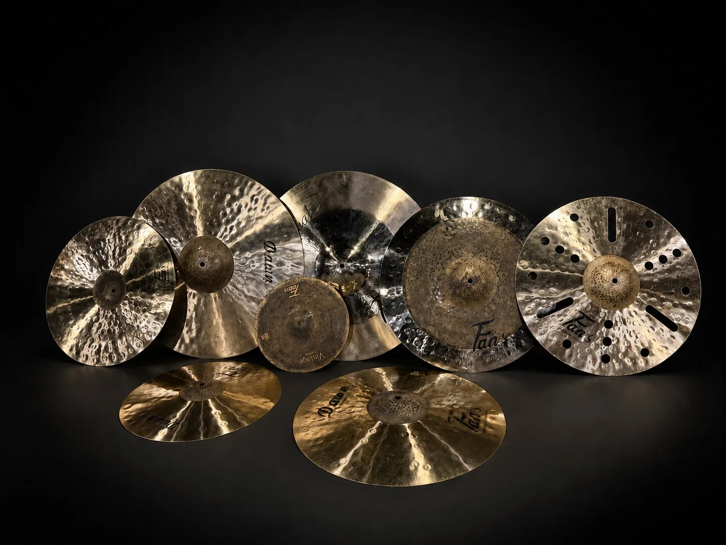 Hand-hammered B20 cymbal set arranged on a dark stage