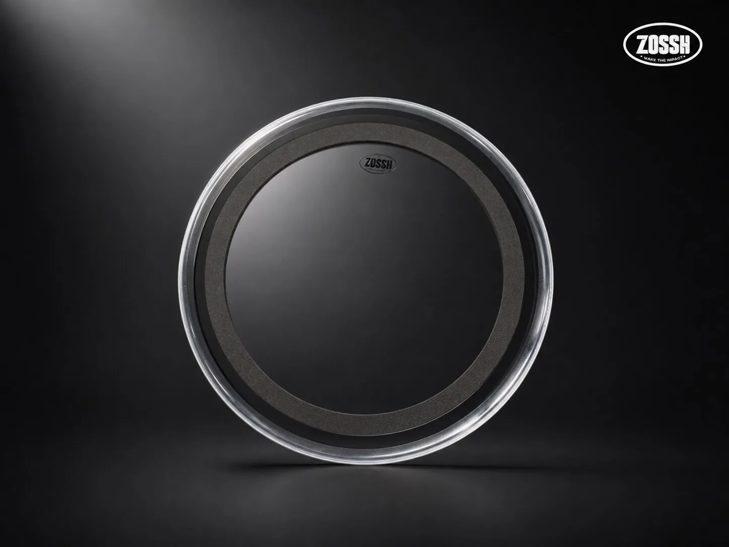 A single ZOSSH drum head under a dramatic spotlight